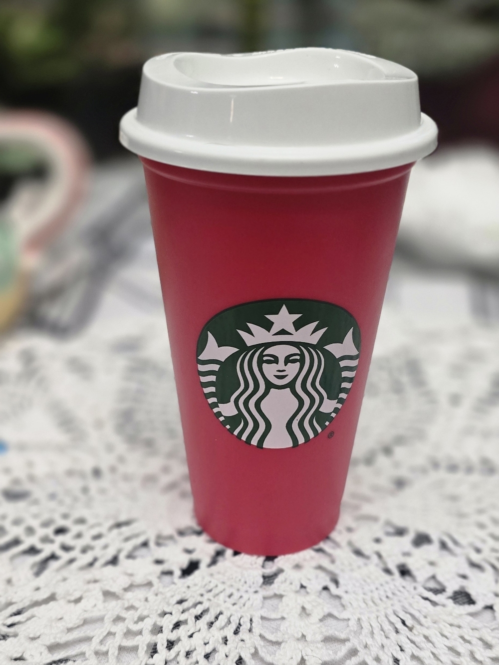 Starbucks Red Cup with Green Logo and White Lid